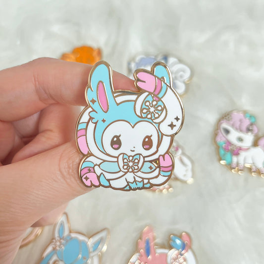 Sylveon (Shiny) – Winter Poke Enamel Pin Series by Mooncake Pin